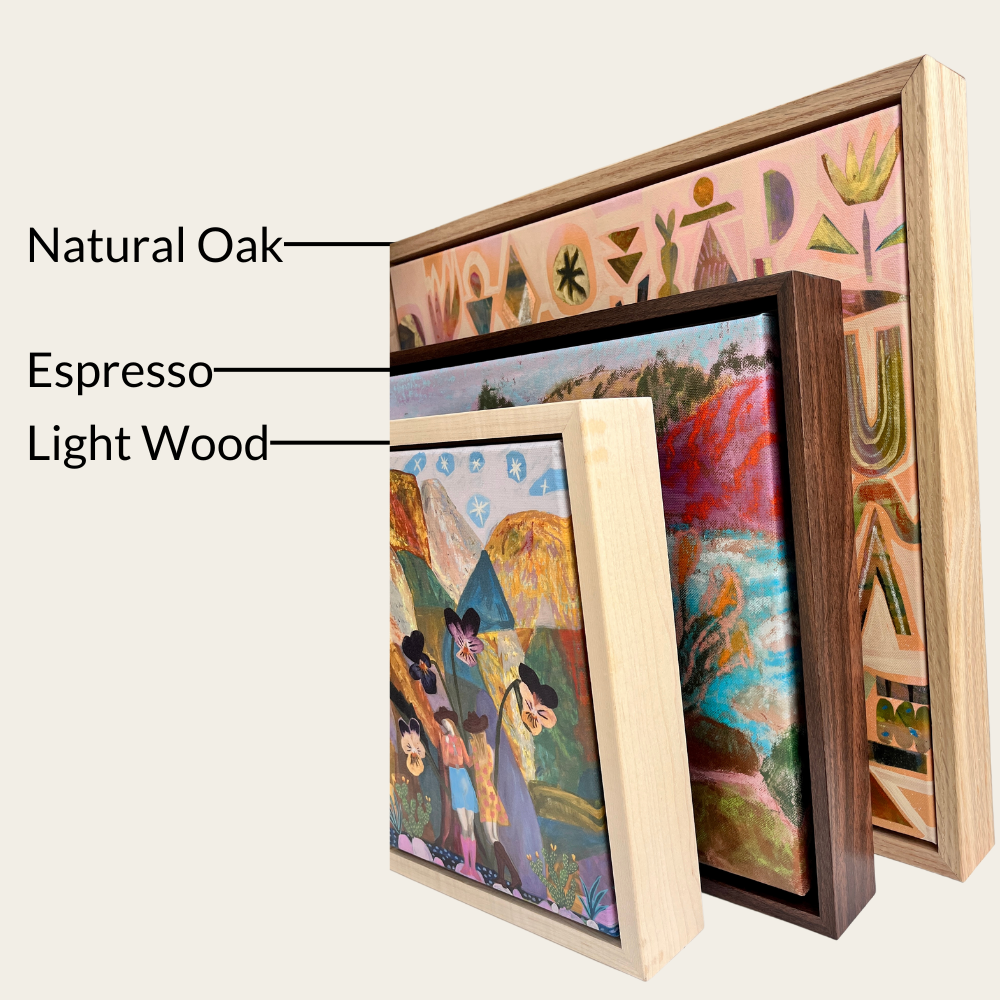 three framed artworks, each with a different type of wood and frame, including natural oak, espresso, and light wood.